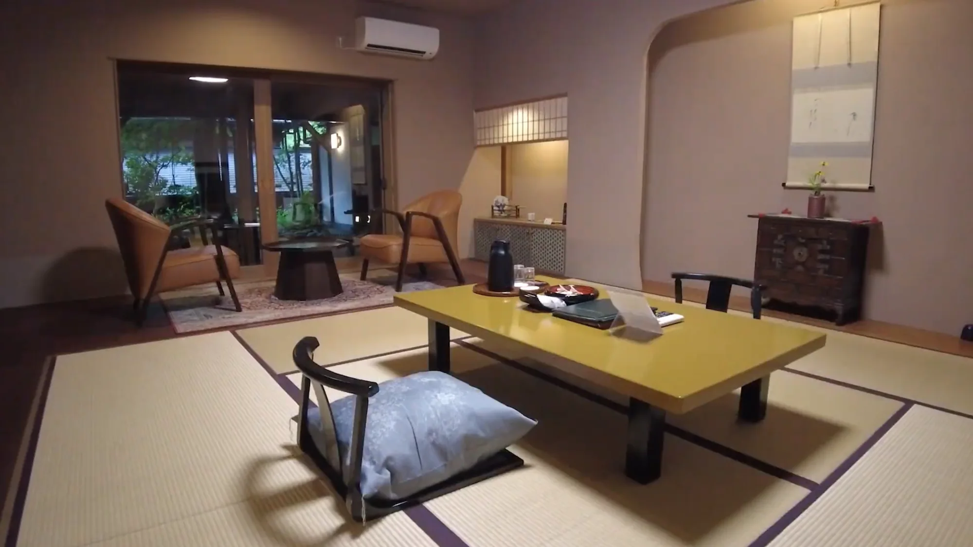 A tatami guest room with a low table at a Kurokawa ryokan