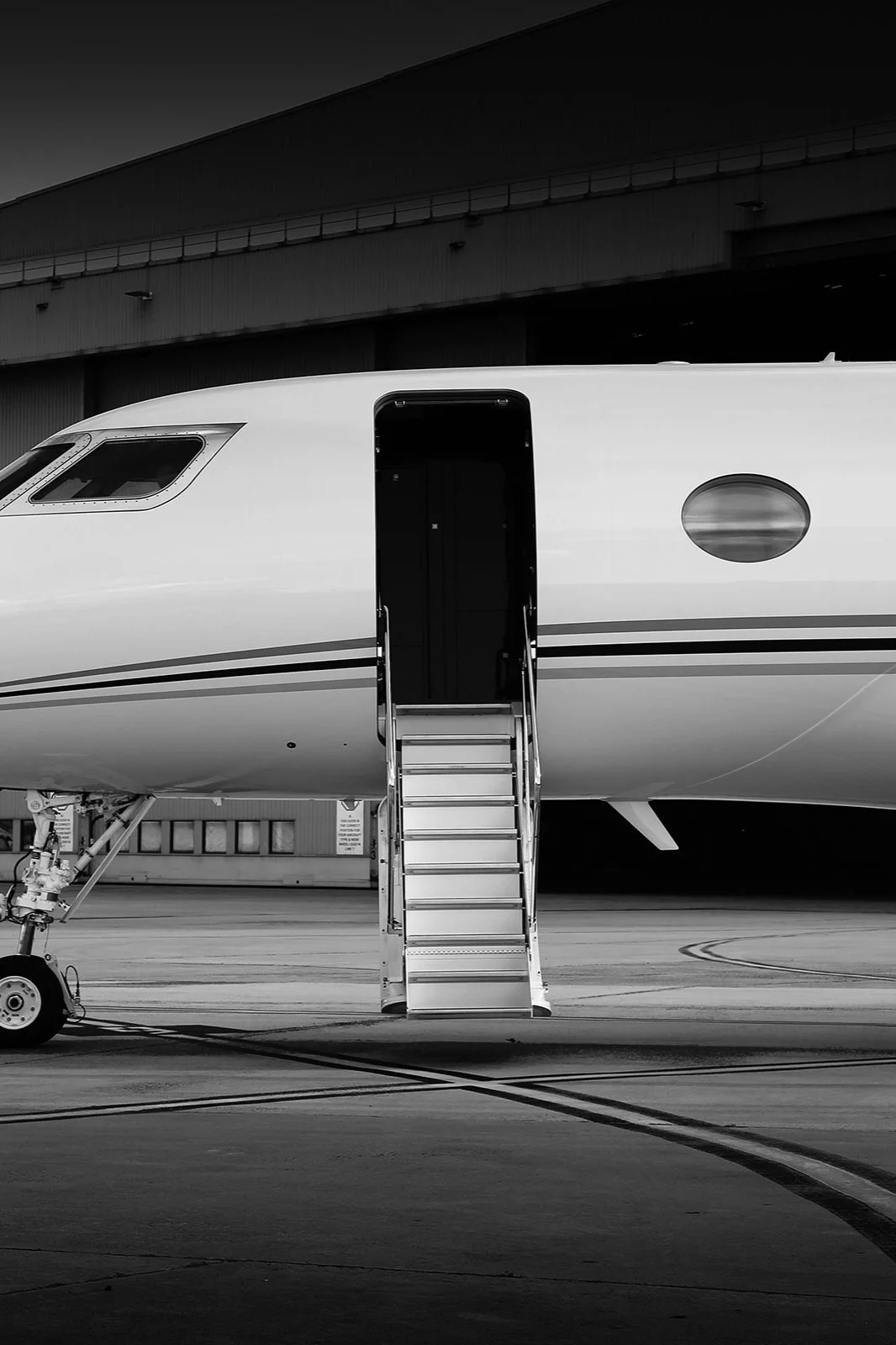 Airplaine with the door open in a way that it looks like you can just walk in to it