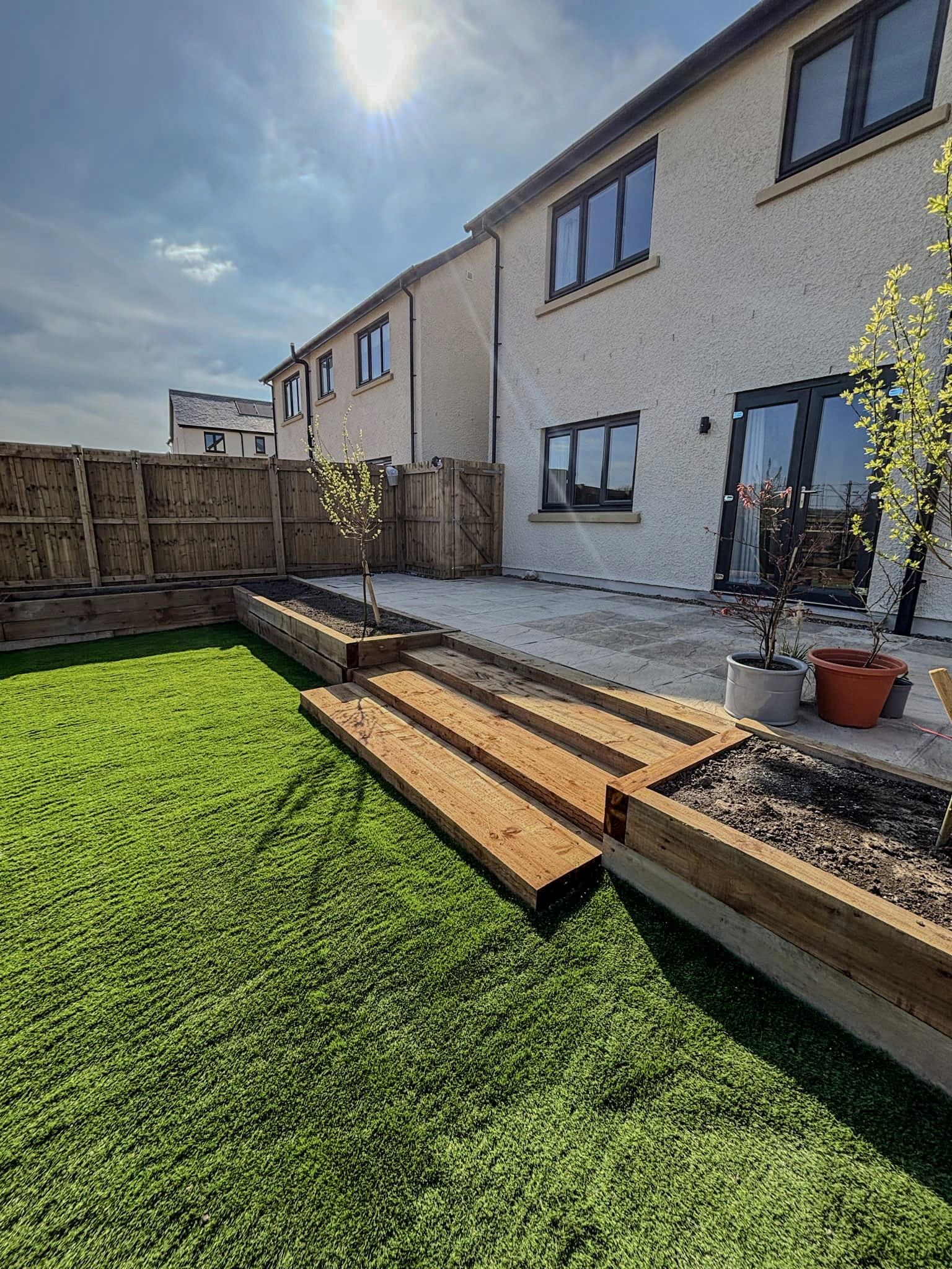 contemporary glass home with lawn