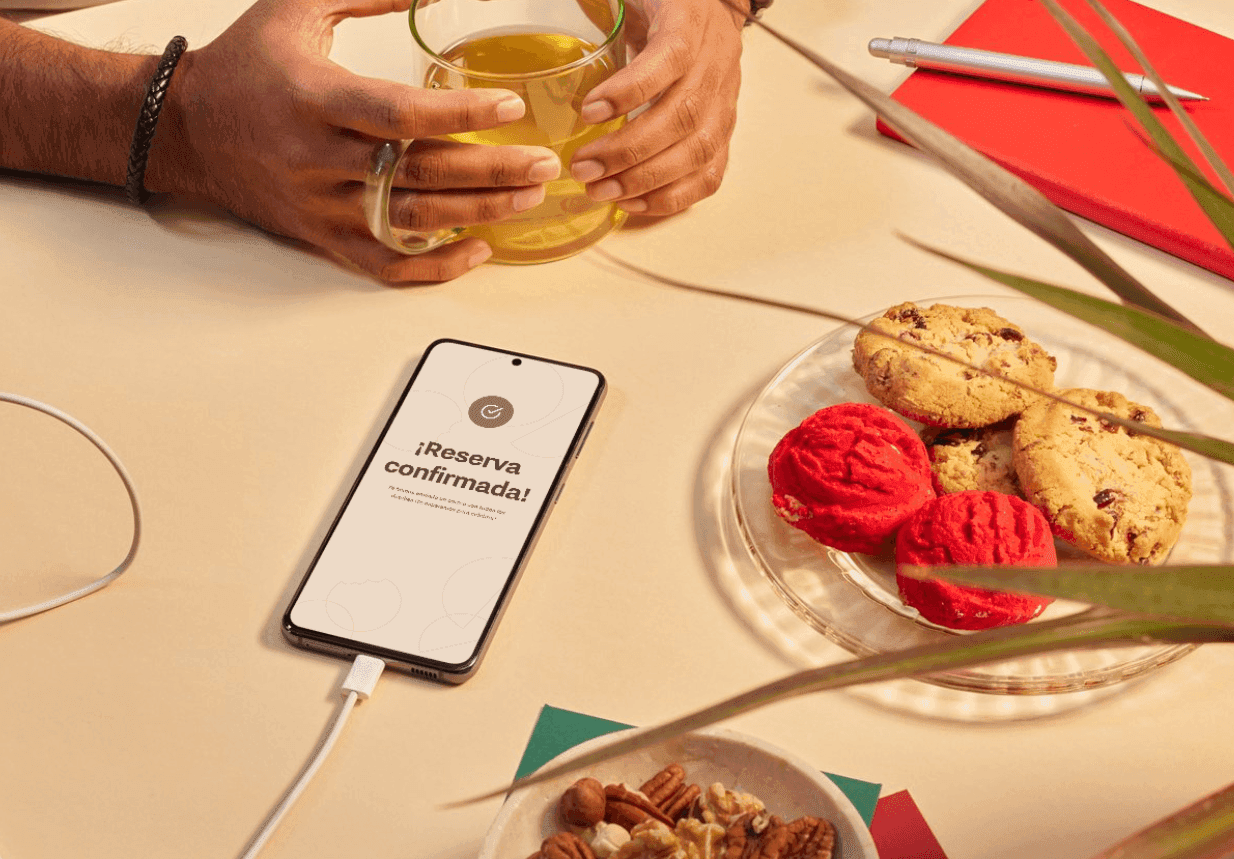Glass lab beaker with clear liquid and delicate flower petals—elevated beauty-science still life.