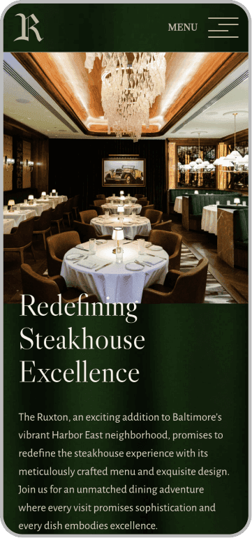 Elegant steakhouse dining room with round tables, white tablecloths, green chairs, chandeliers, and dark wood accents, as described on a restaurant website page.