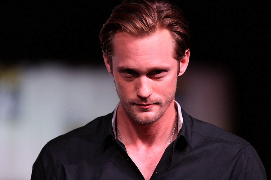 Portrait image of Alexander Skarsgård gazing at the camera