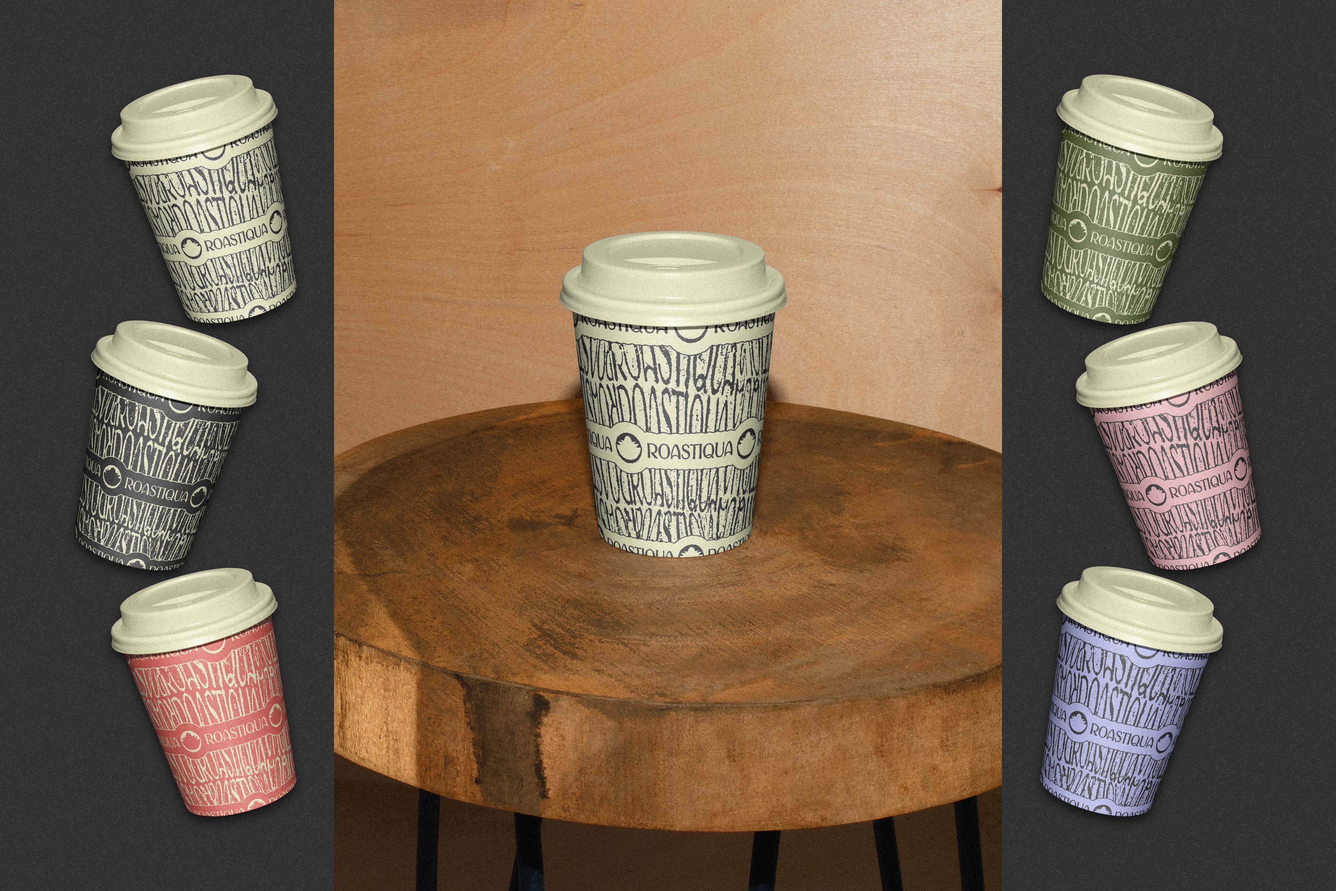 Assorted takeaway coffee cups with hand-drawn wordmark pattern in multiple brand colors around a central cup on a wooden stool - Roastiqua, a specialty coffee brand identity.