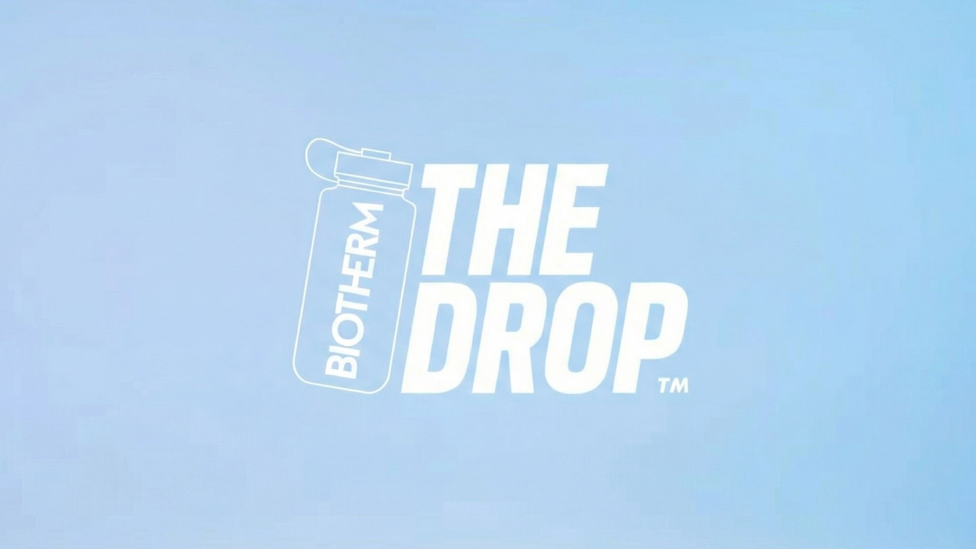 Woman wears a blue coat in a blue environment.