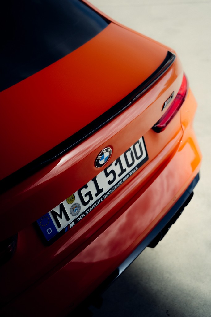 Orange BMW M3 G80 parked