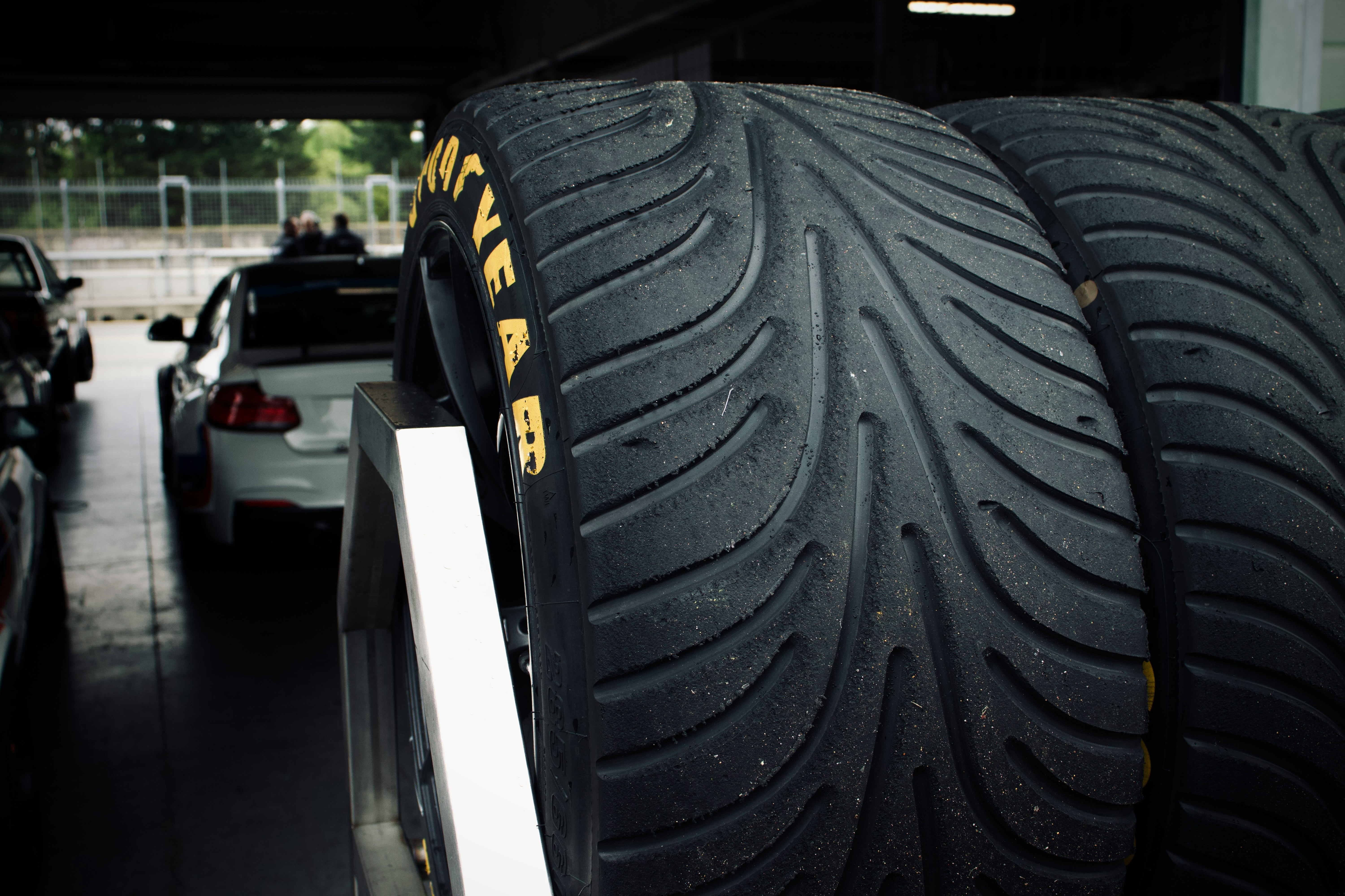 a couple of tires that are sitting on a rack