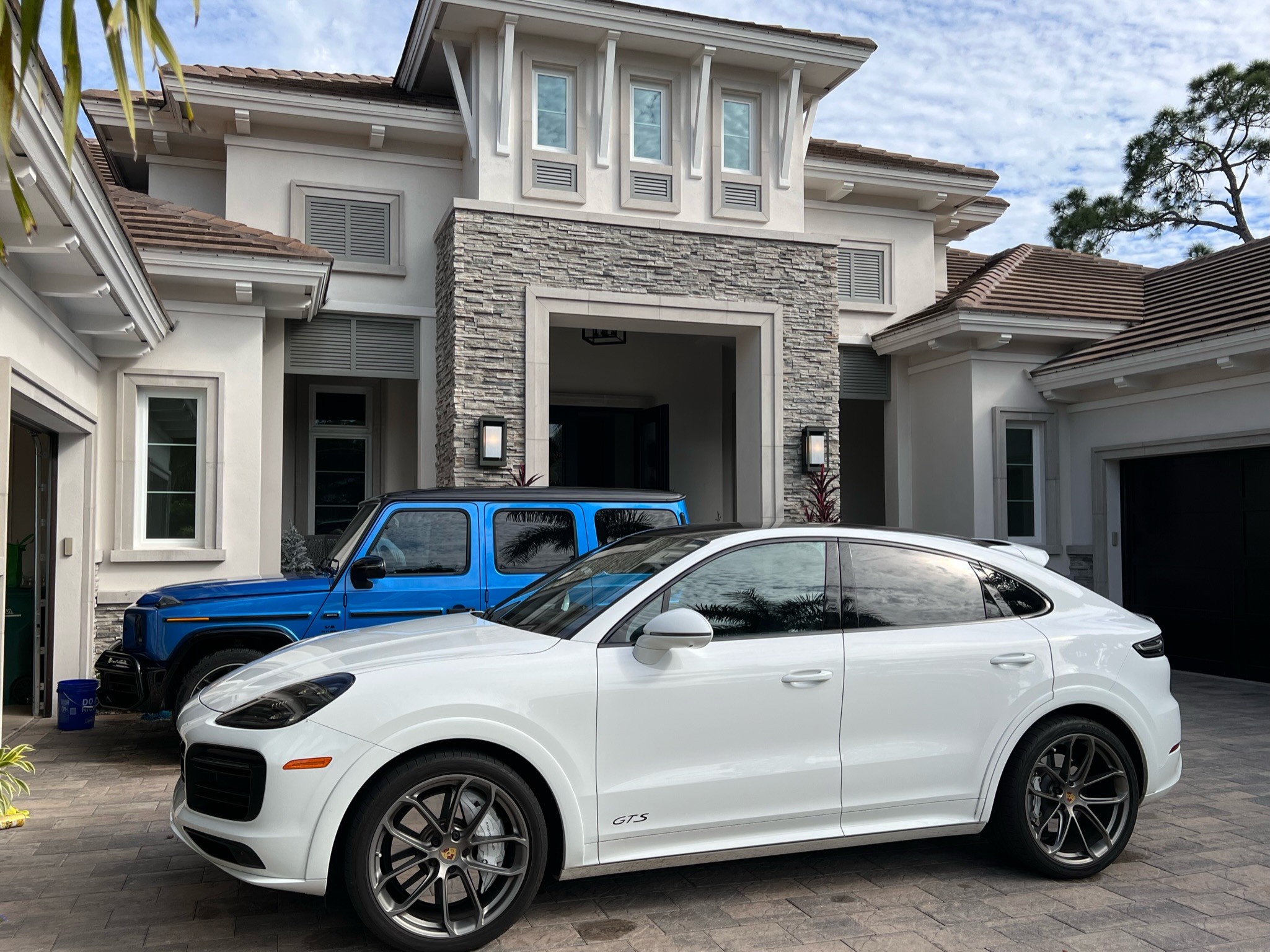 Gulfstream mobile detailing finiished product of a interior and exterior detail on a blue g-wagon and and white porsche cayanne showcasing top tier detailing jobs in southwest florida