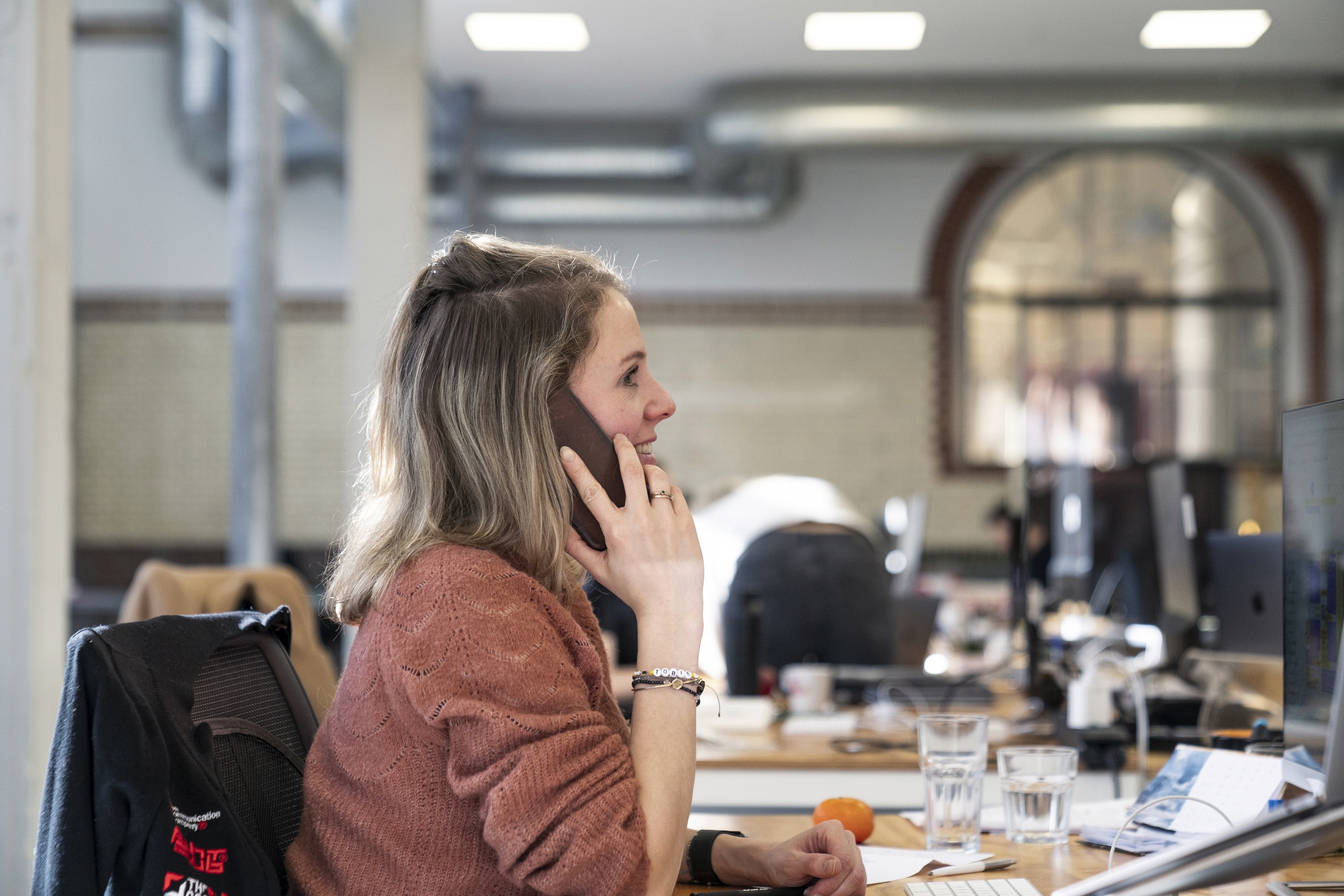 a woman reporting data on the phone