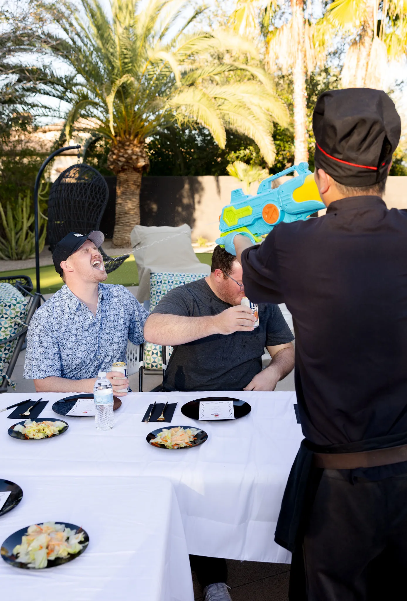 A Hibachi Guru chef entertaining guests at an outdoor table