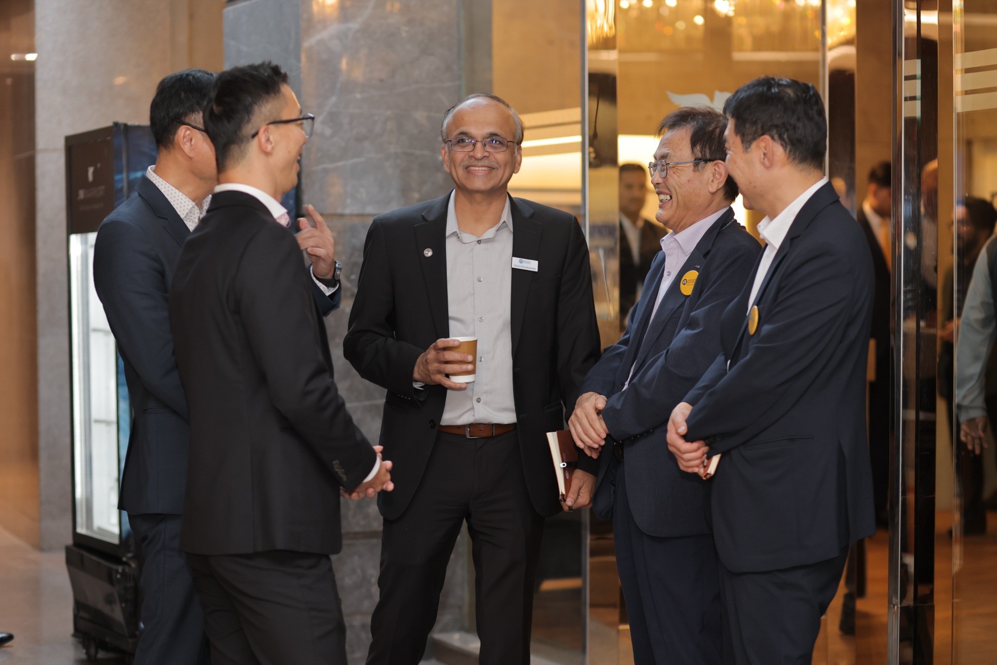 Applied Materials leaders networking with guests