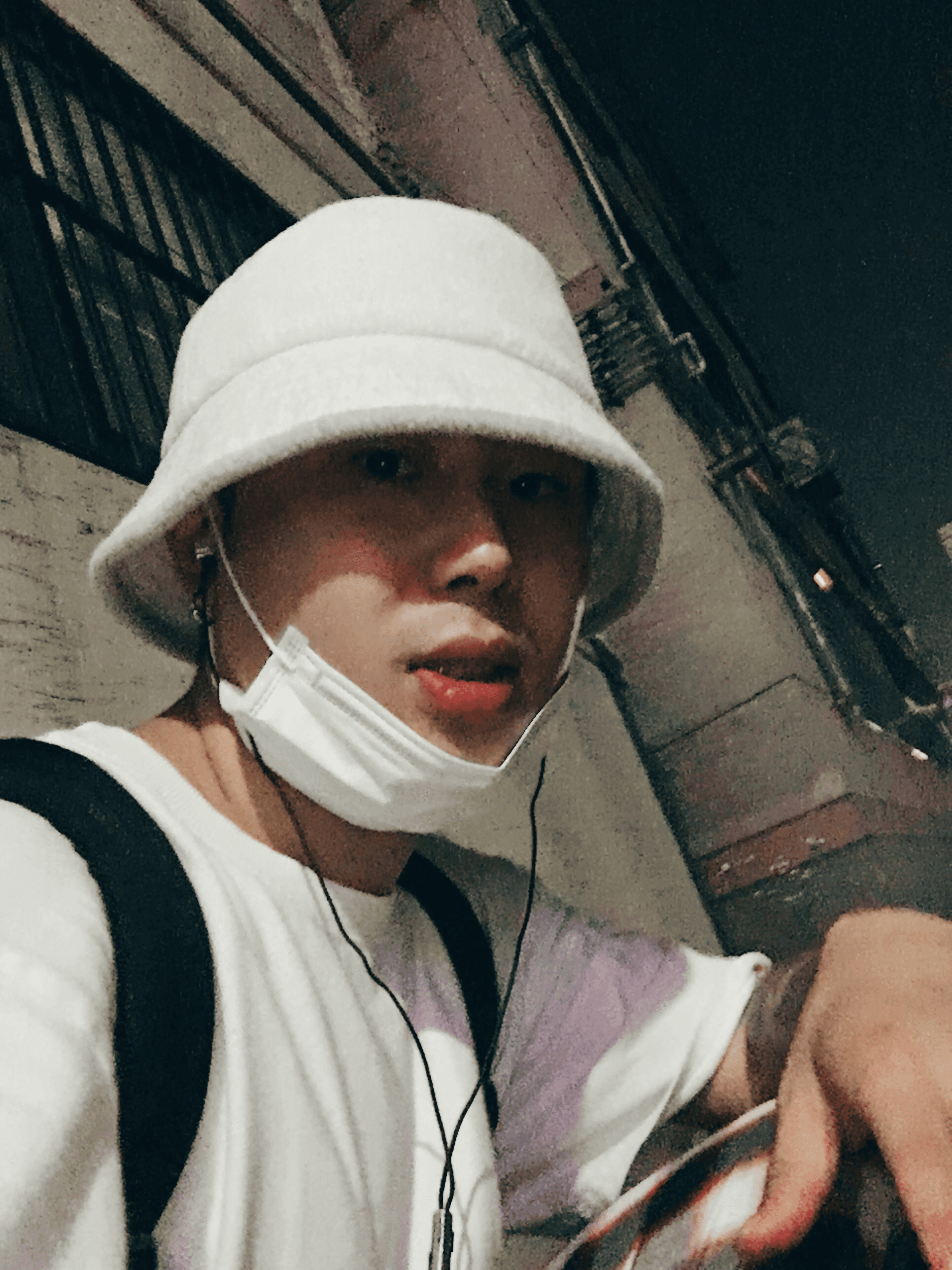 headshot of male in dark background