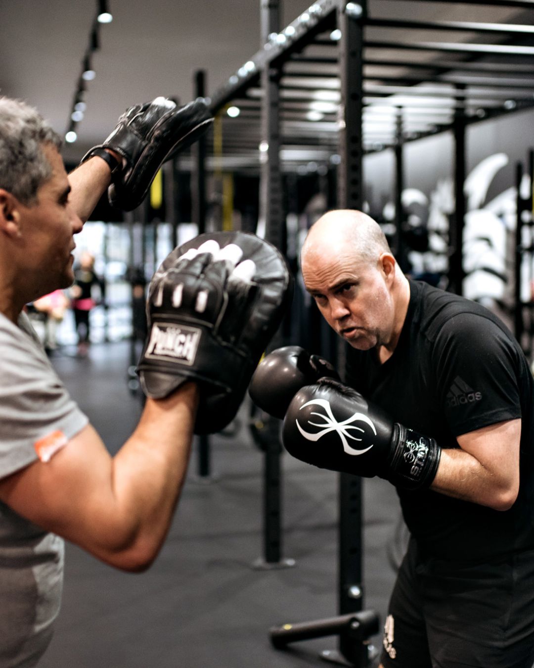 A man stading with Surfboard