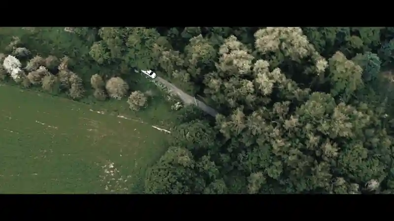 Group of presenters speaking on camera during a Microsoft live broadcast, filmed against branded event graphics.