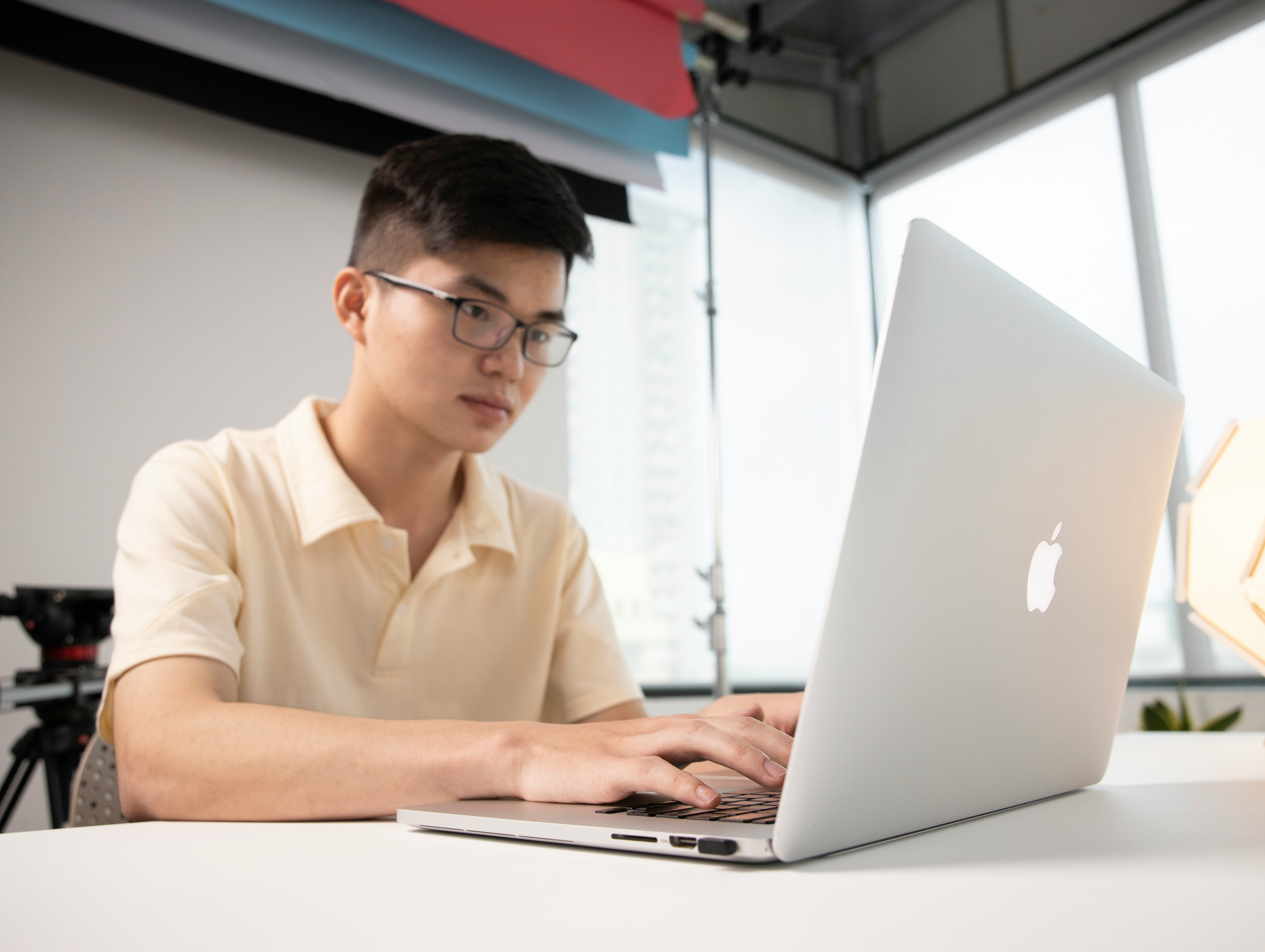 a man sitting in front of a laptop computer