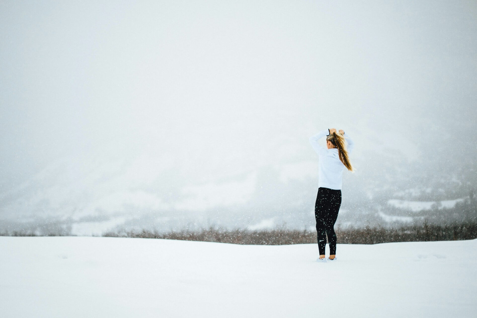 Woman standing in snow