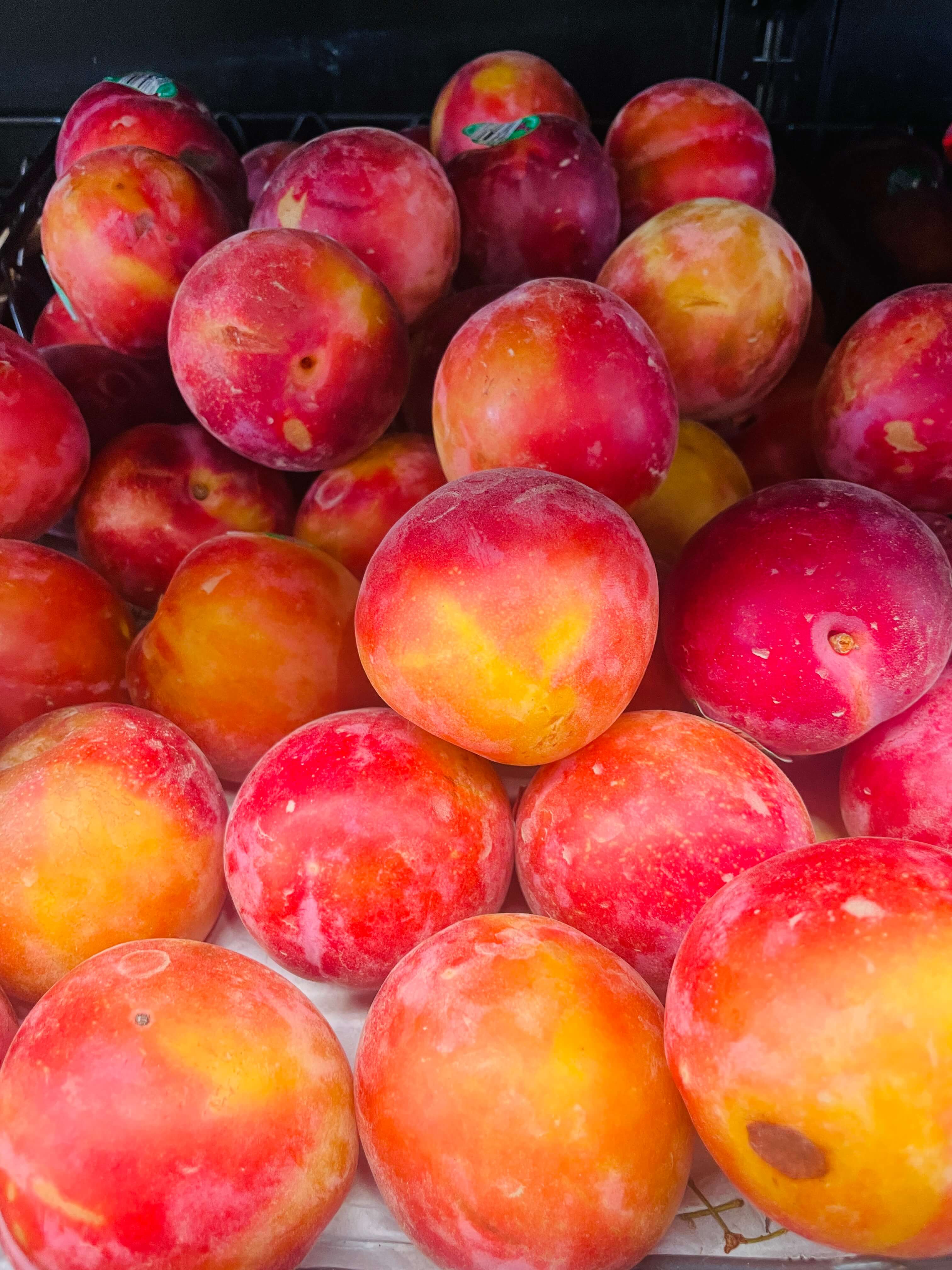 Red plums at International Food Market Orlando.