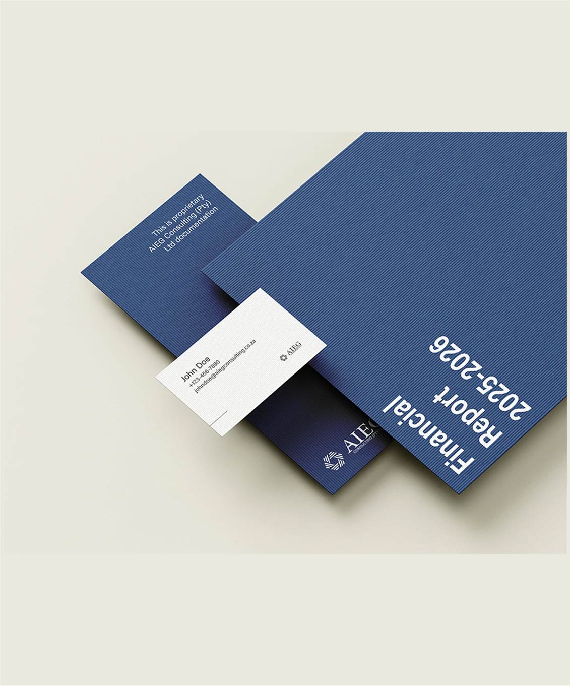 Brand mockup featuring blue and white envelopes and business cards arranged on a grey backdrop to reflect brand consistency