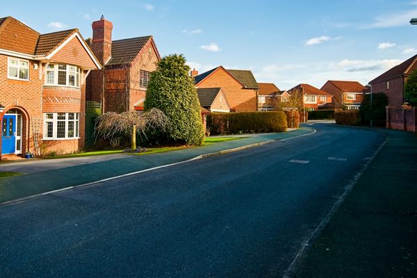 Residential street with smooth pavement representing Mainmark’s road subsidence and pavement repair solutions