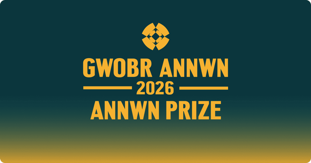 A single red mushroom with white spots on forest floor.