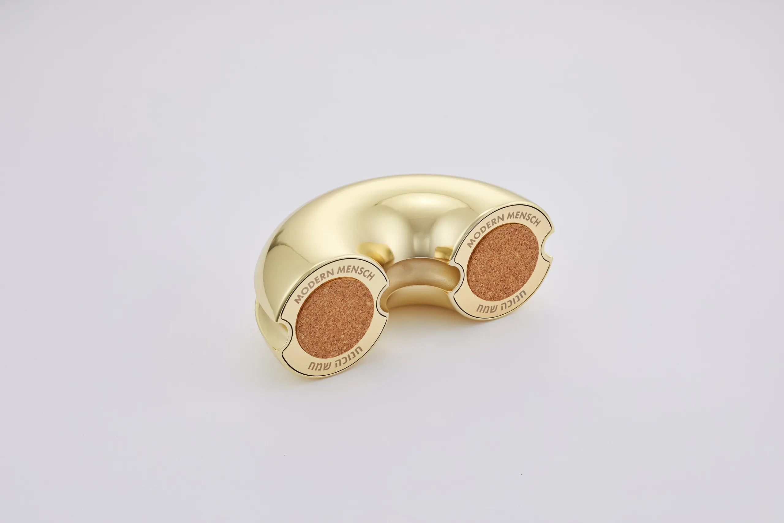 Gold Nosh Menorah form study showing the cork-lined underside