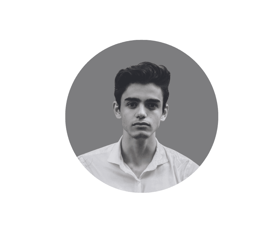 Portrait of a woman with straight long hair, in a dark t-shirt, set against a neutral backdrop.