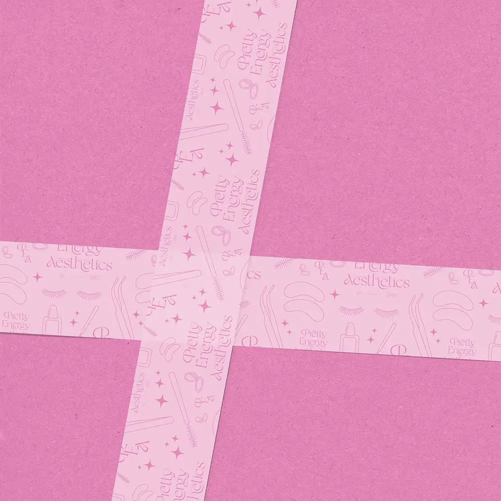 Pink Pretty Energy Aesthetics patterned tape crossing a pink surface
