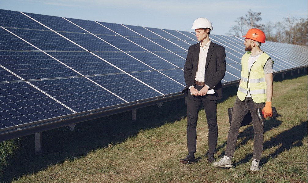 technician checking solar panel