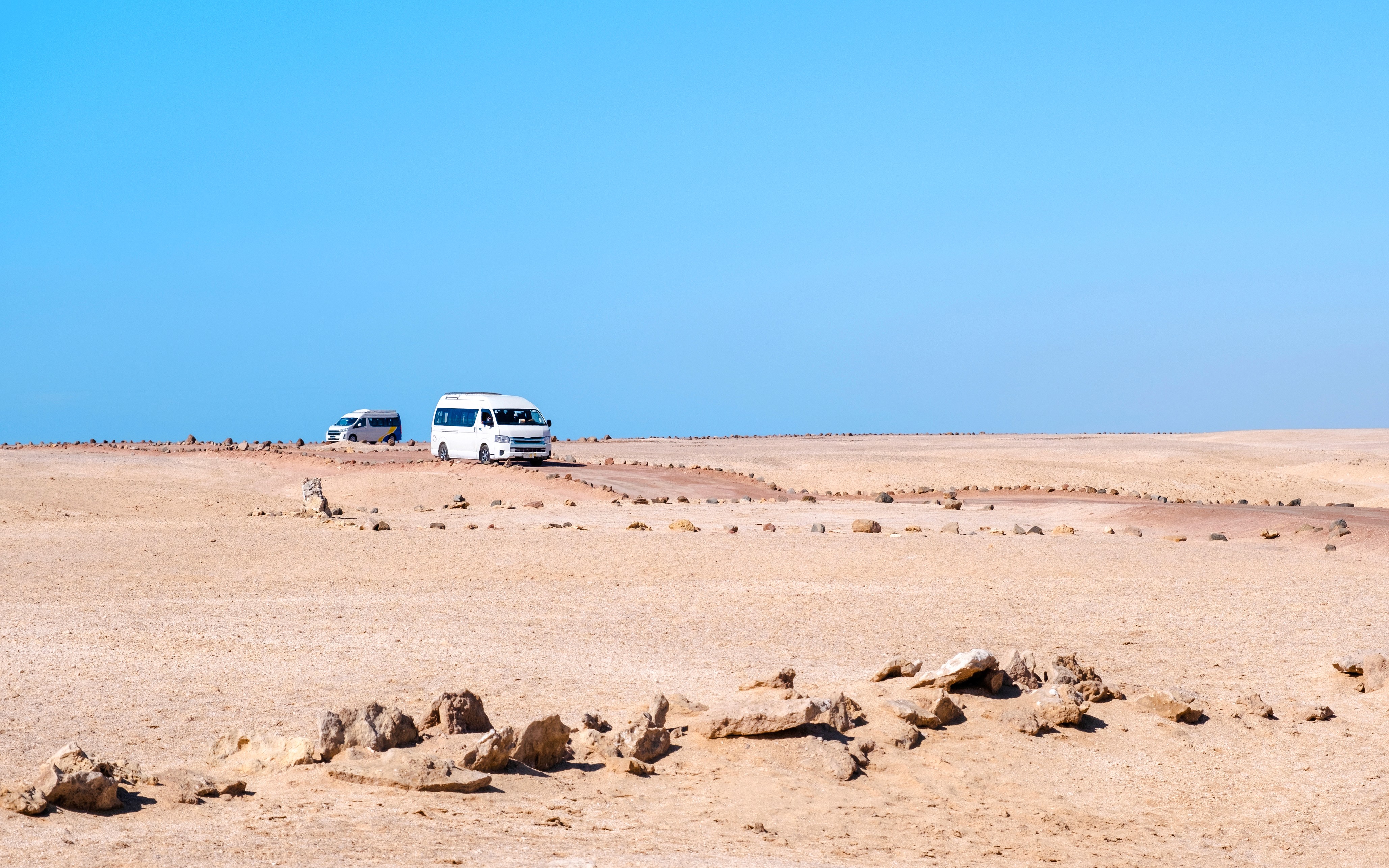 Tour buses driving through the desert in Ras Mohammed National Park.