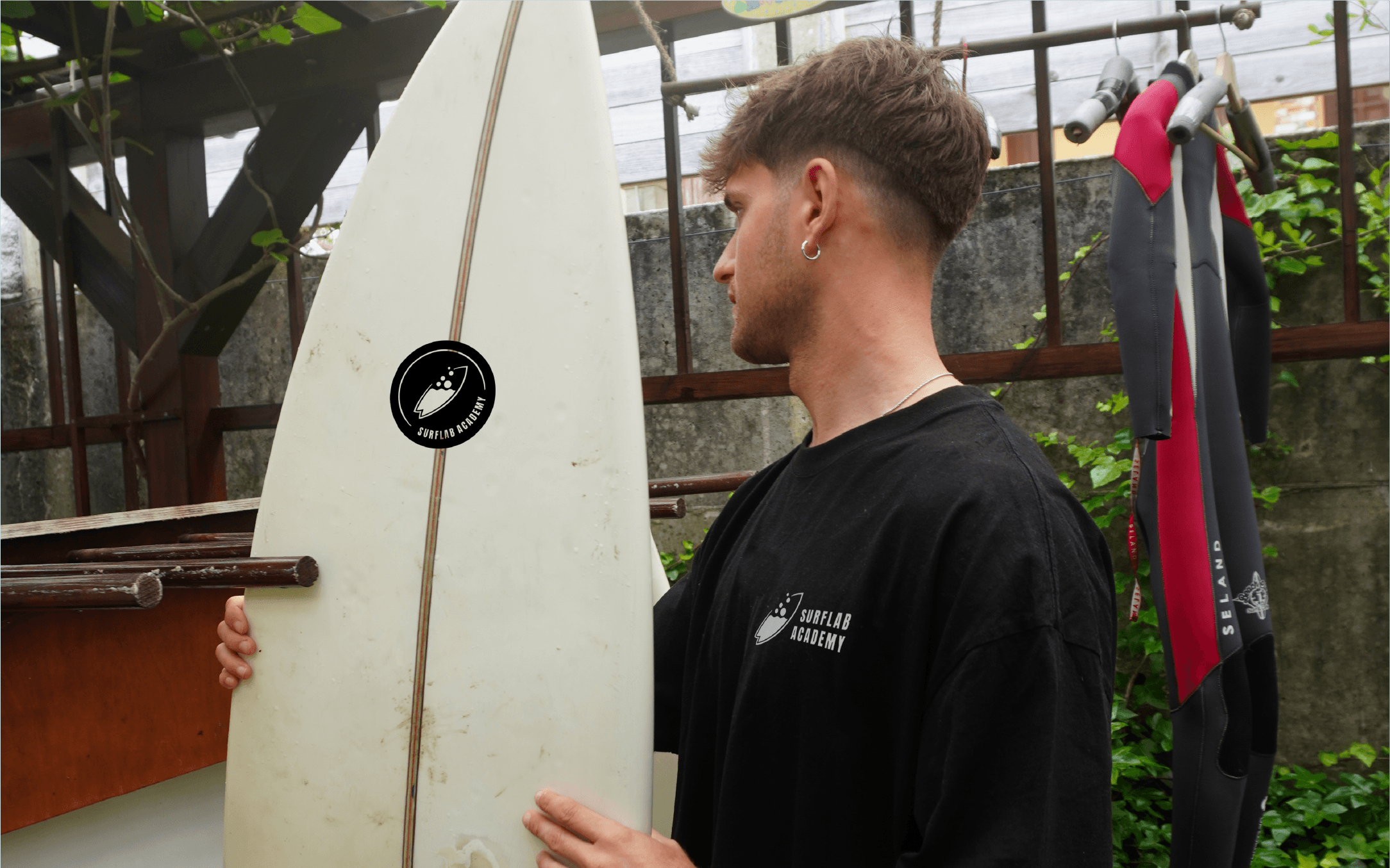 Surflab academy logo sticker on surfboard