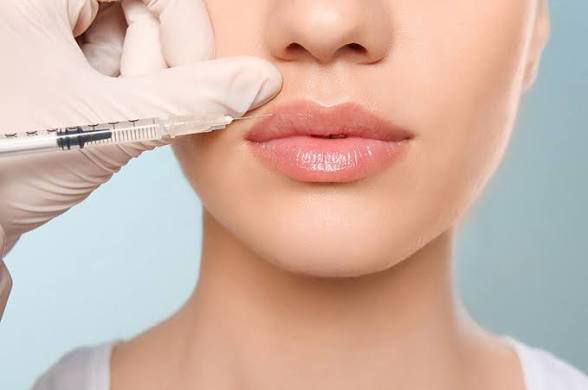 Botox injection being administered to a woman.