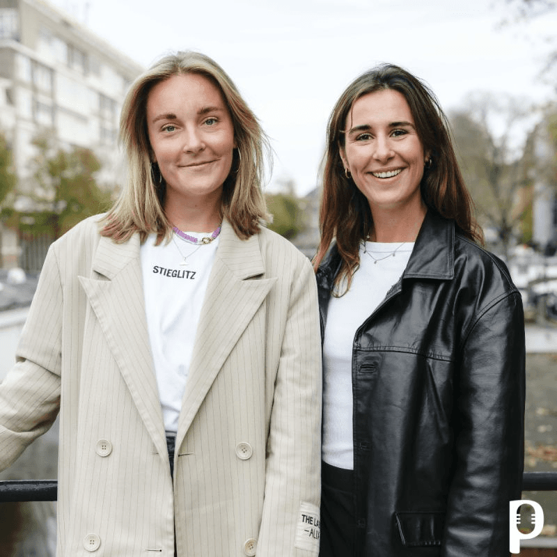 man with glasses smiling fully 