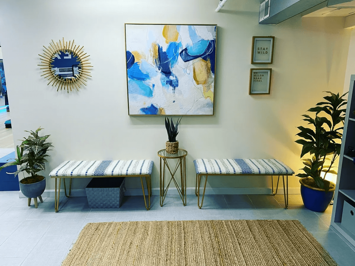 a woman is doing a piyoma exercise in a gym