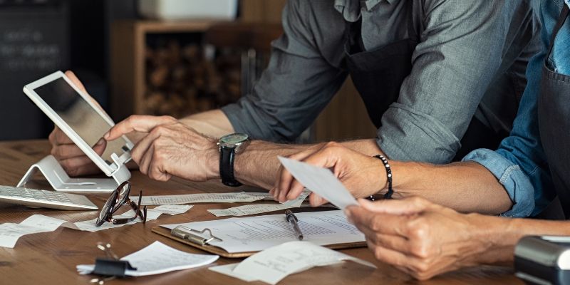 Small F&B business owners doing calculations for their business