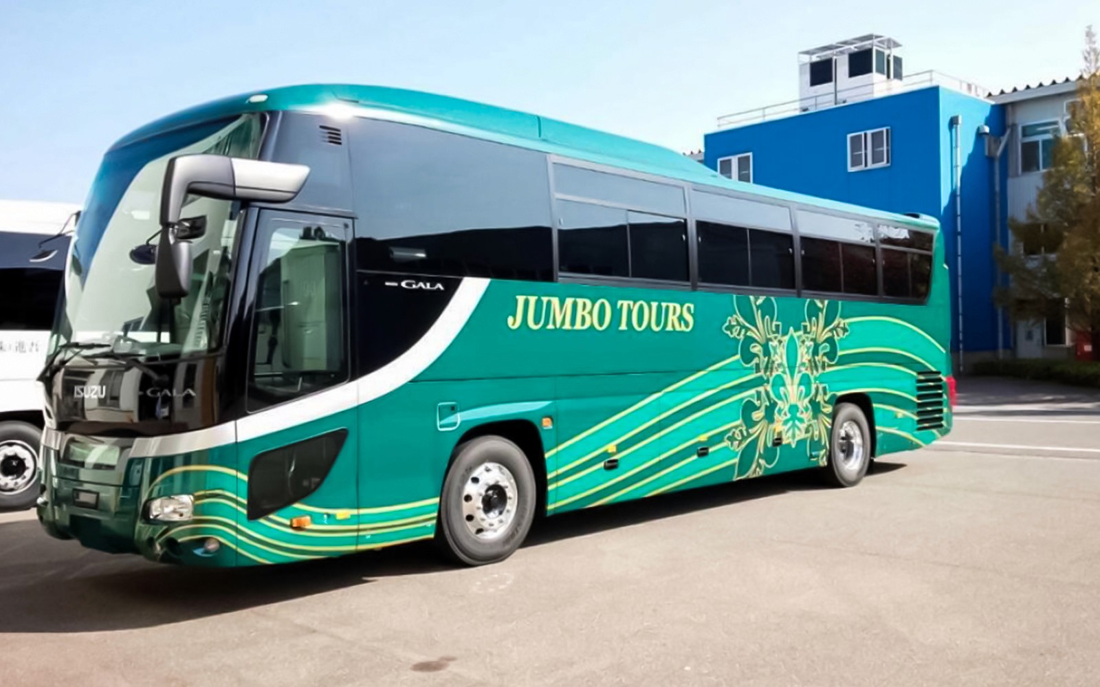 Tour bus for Okinawa Hip Hop Bus Tour parked outside.
