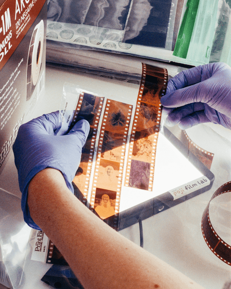 someone sleeving cut 35mm film 