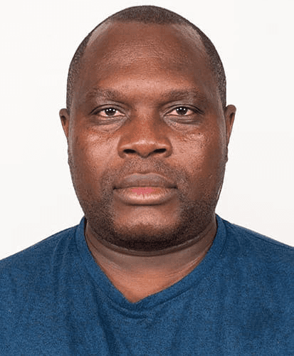 a man wearing a blue shirt and glasses