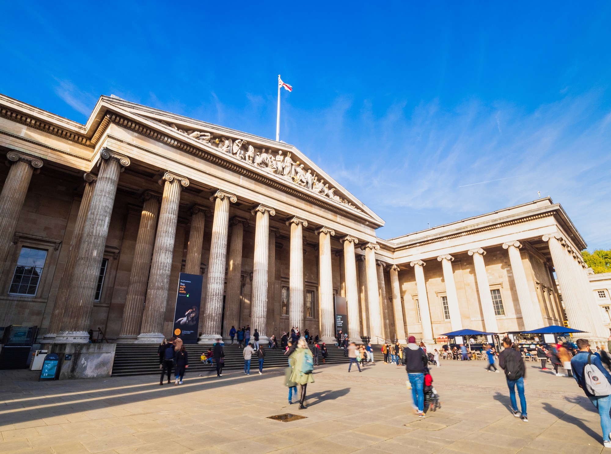 an aerial view of a baseball stadium with a city in the background