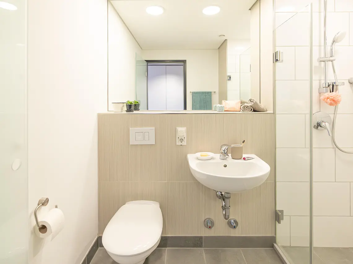 Private bathroom in student accommodation in Frankfurt with shower, sink and toilet