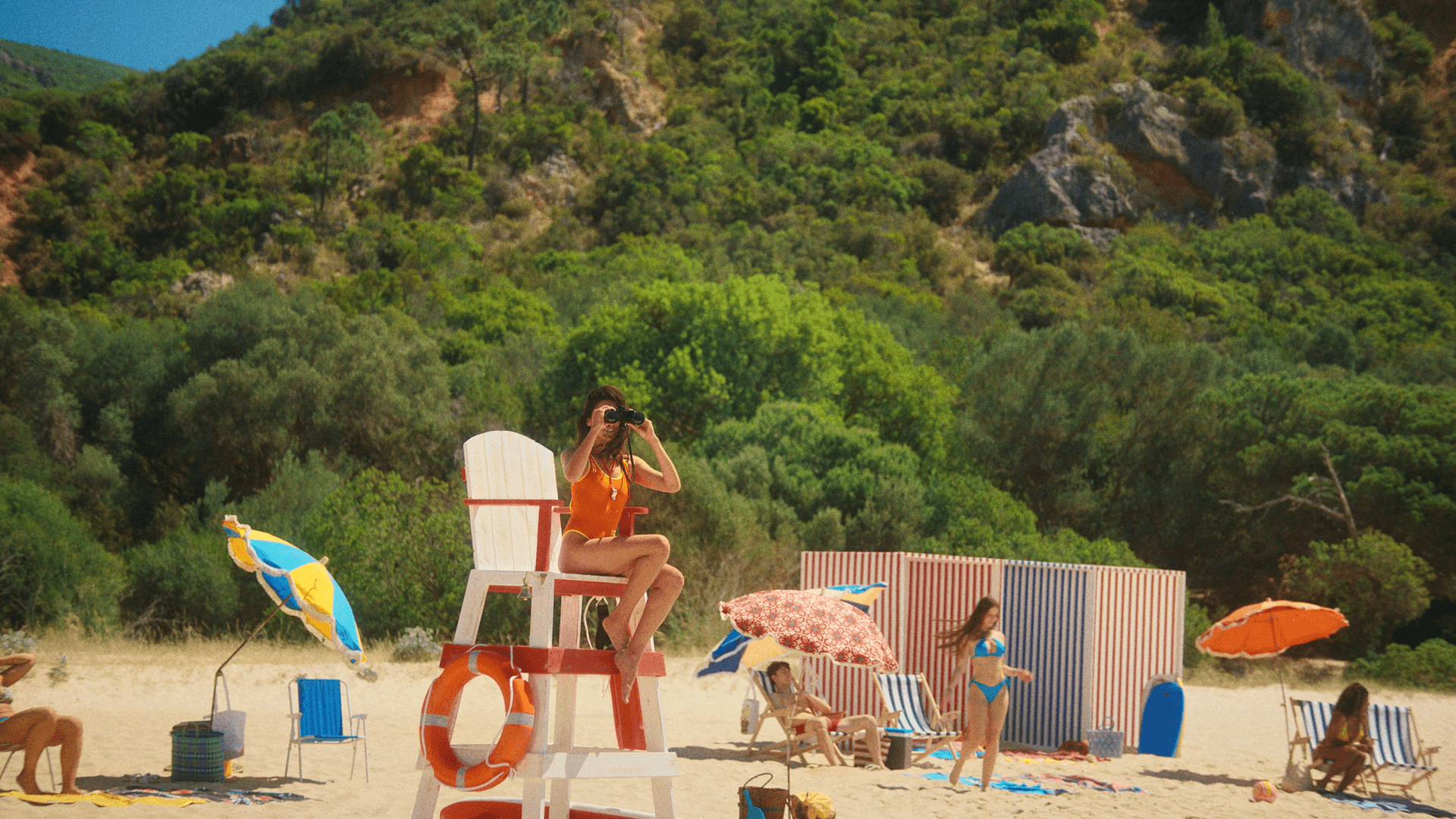 Snow-capped mountain peaks against a pastel sky