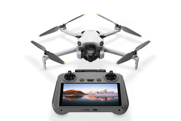 Image of a white drone paired with a remote control that has a screen