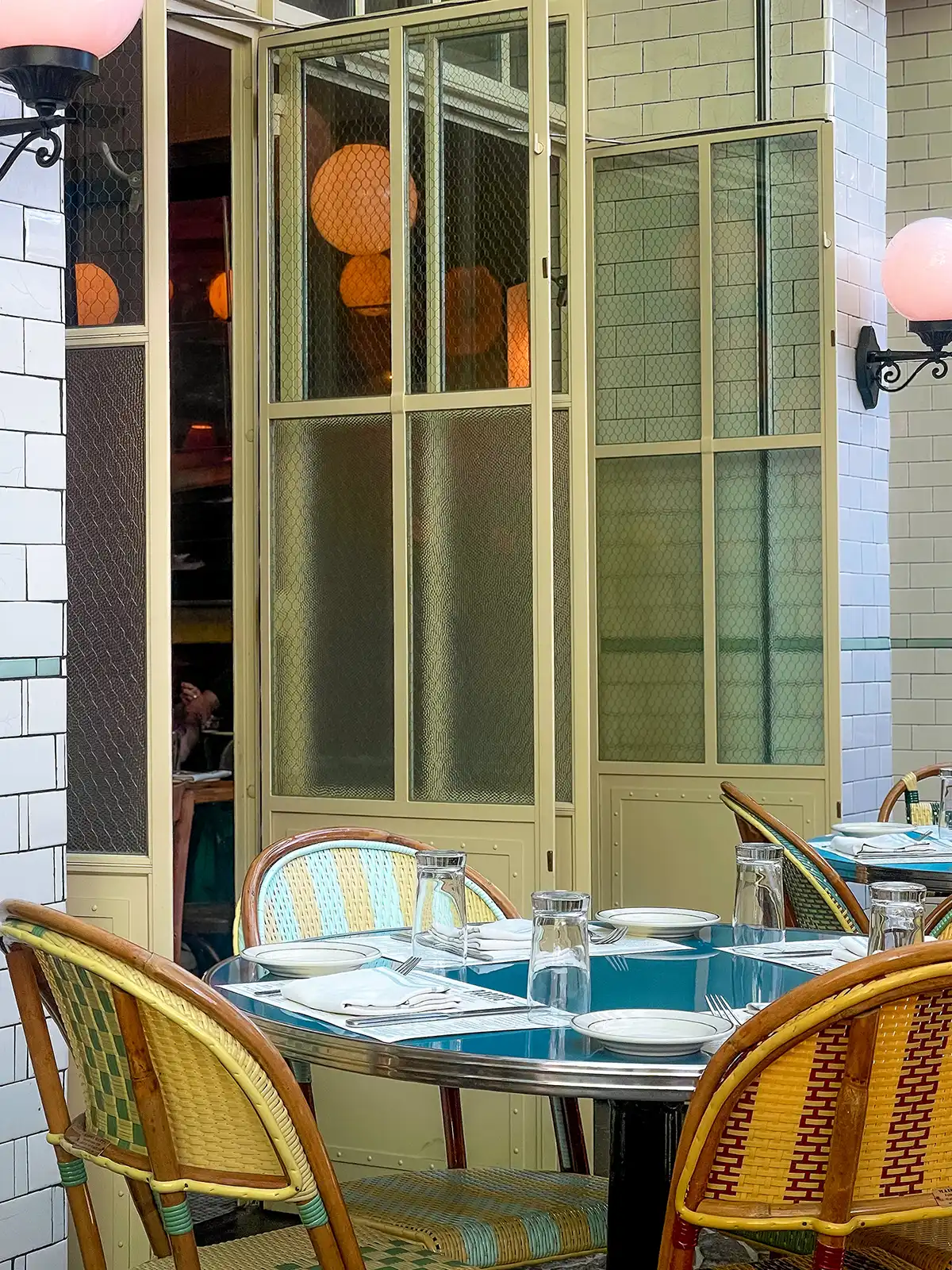 A cafe with open doors and outdoor seating located in a hidden gem neighborhood in Manhattan