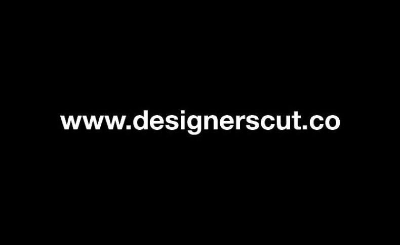 The image displays the text "www.designerscut.co" in white, centered on a black background.