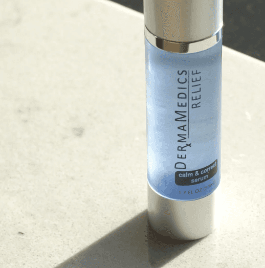 person holding black ipad with green plant