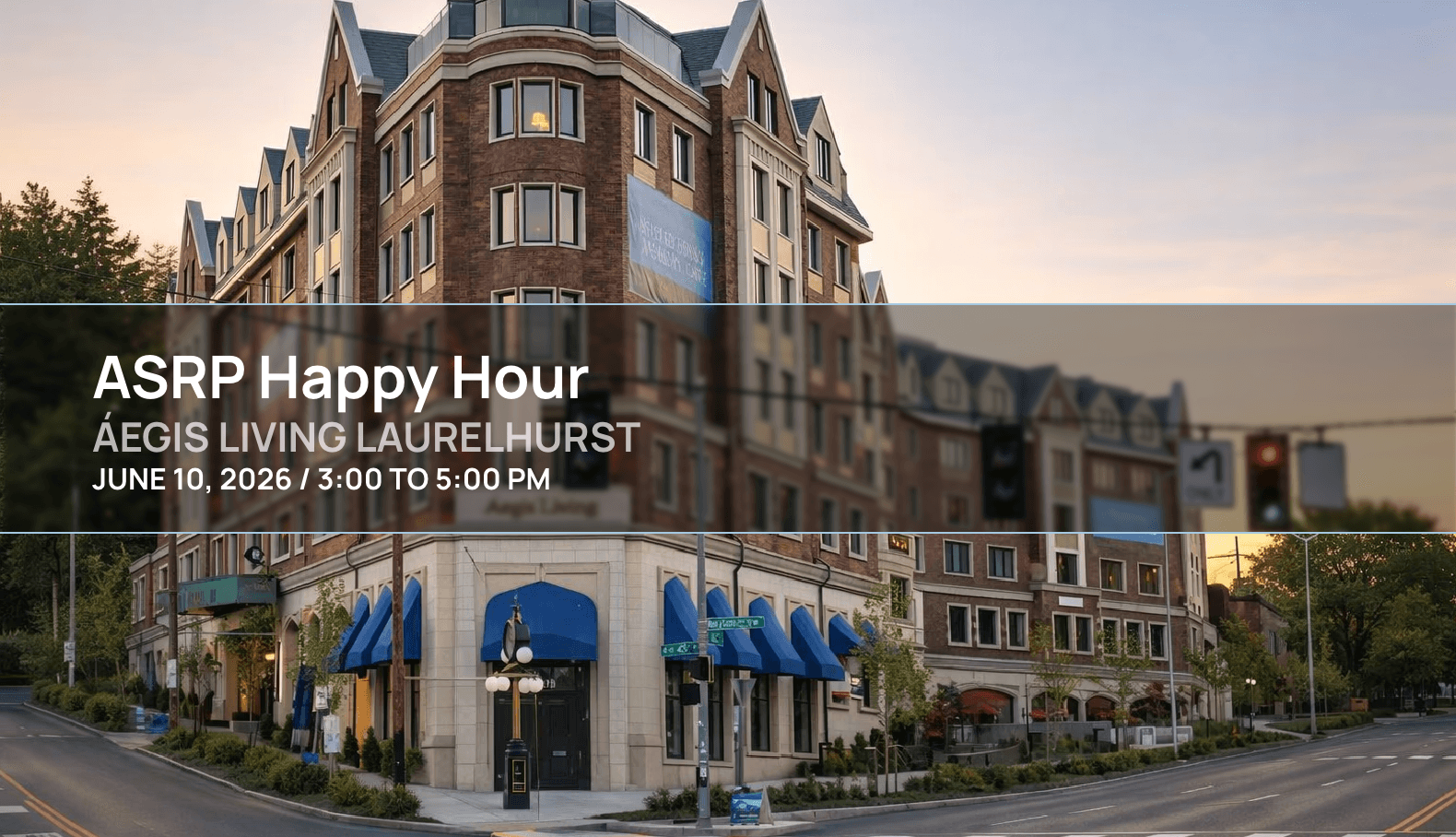 Exterior of Áegis Living Laurelhurst in Seattle at sunset, showing a multi story brick senior living community with blue awnings on a street corner and warm evening light.