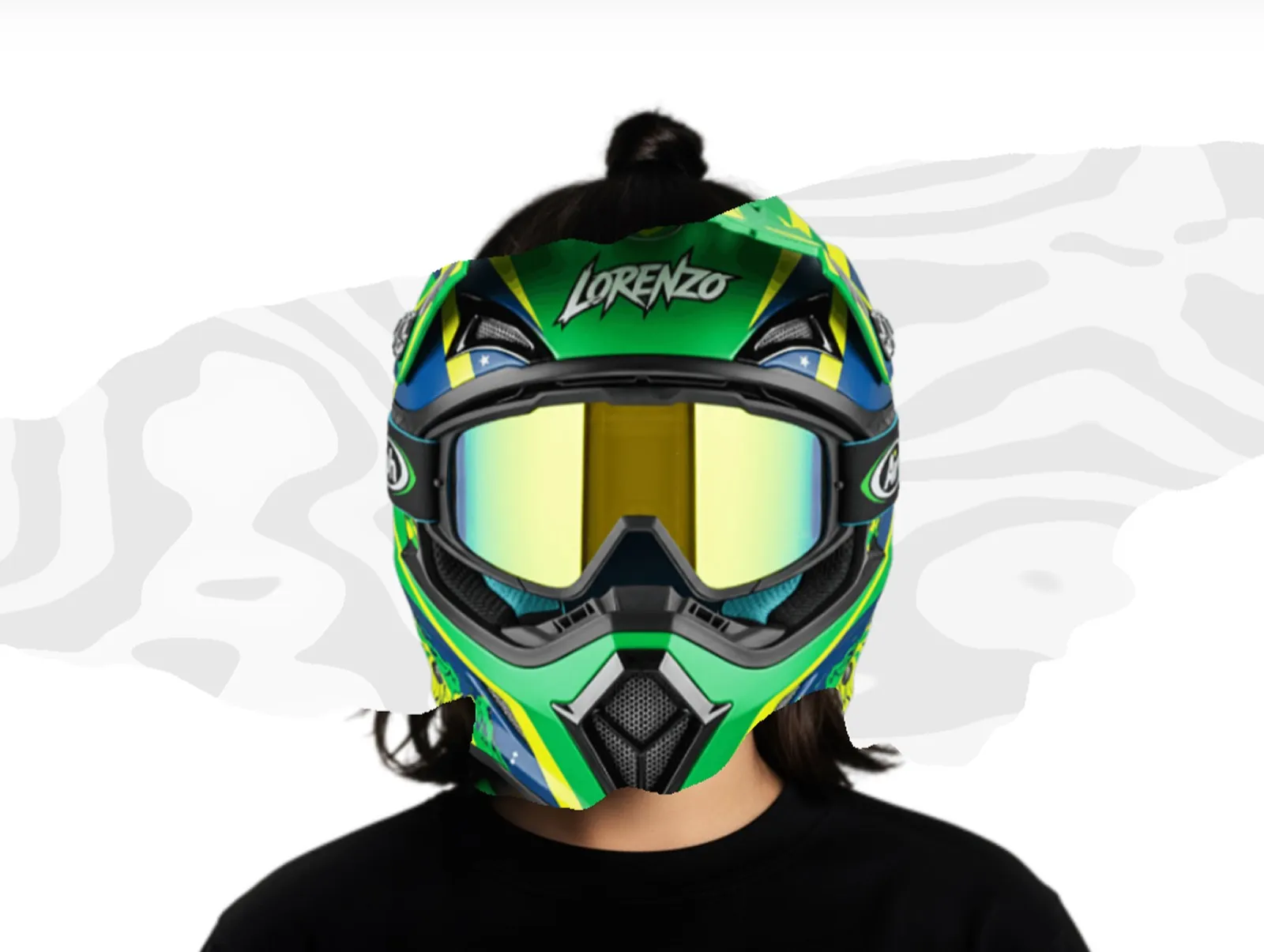 Person wearing a vibrant green and blue motocross helmet.