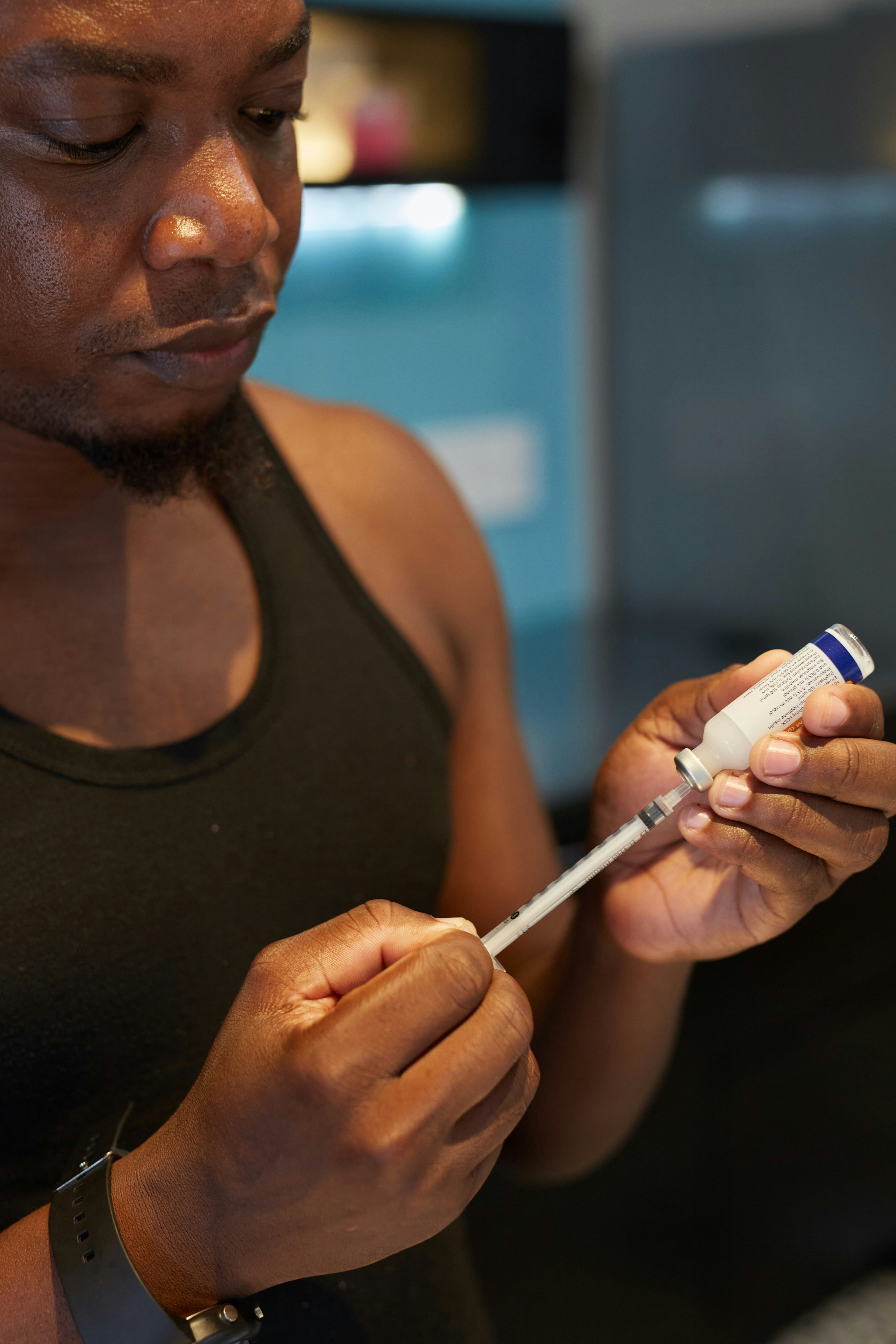 a person holding an injection