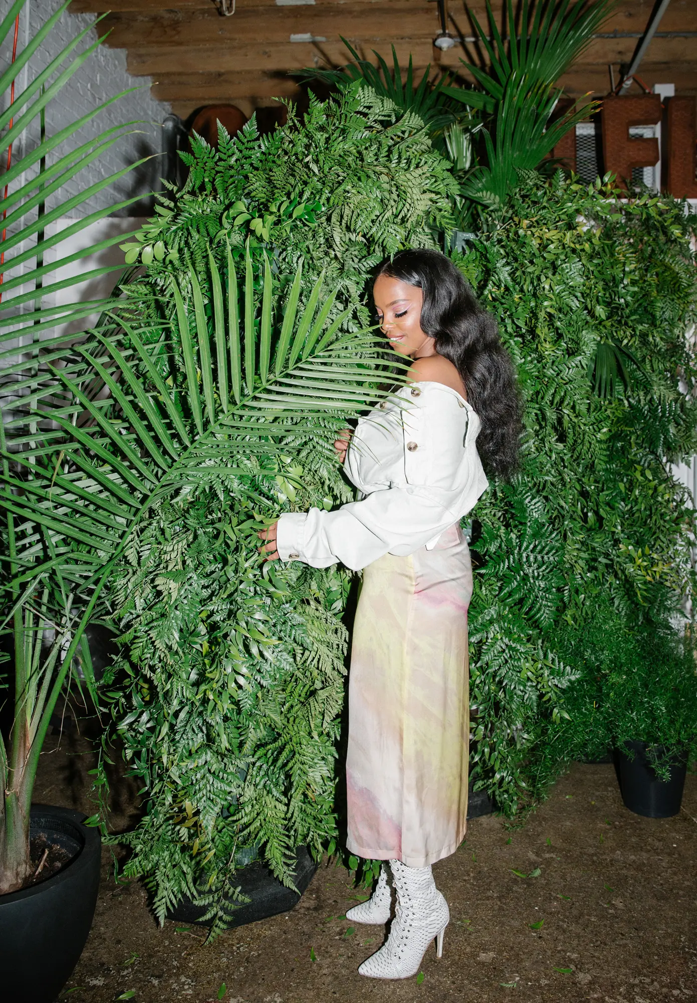 Amaal photographed among ferns and palms