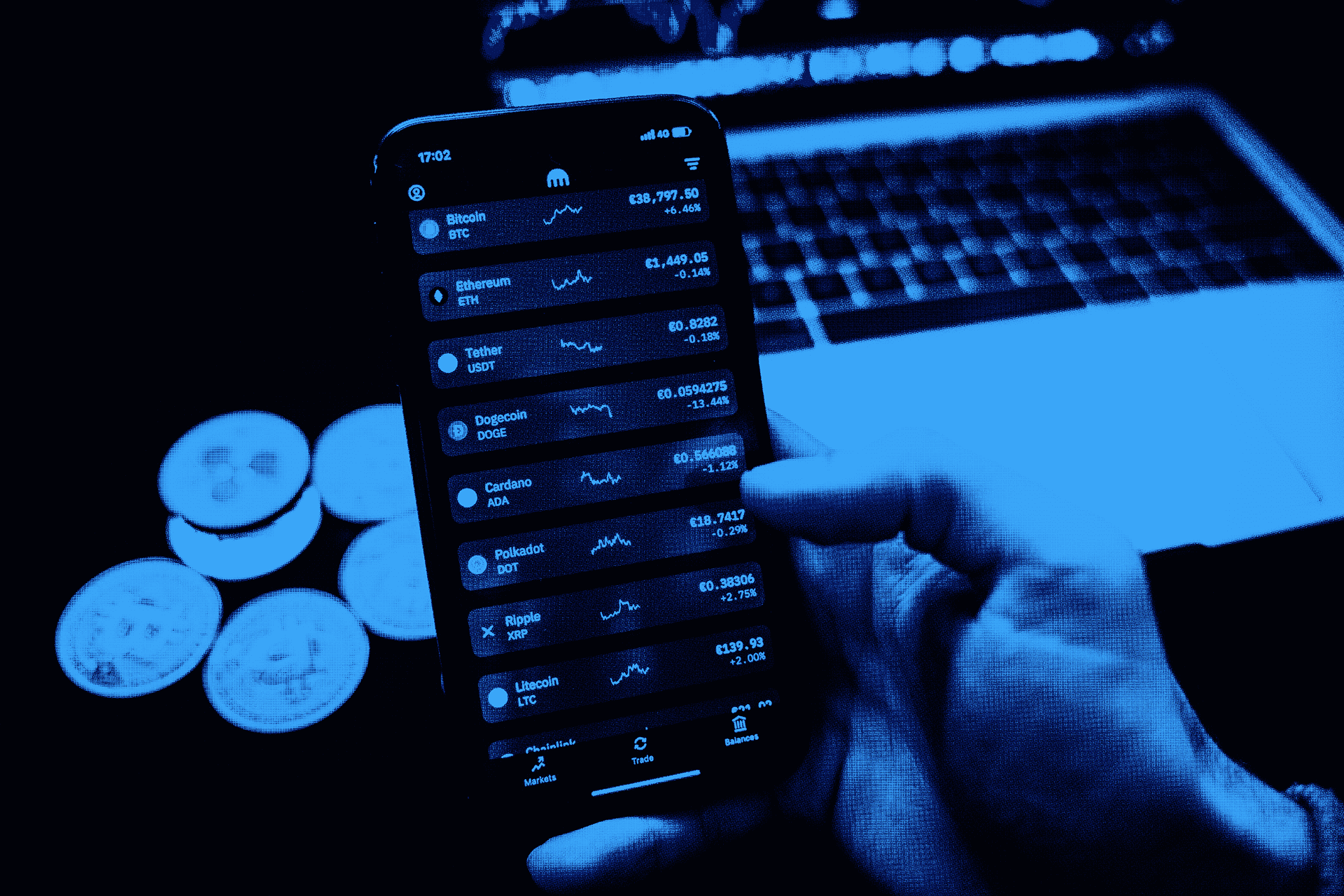 Close-up of a scientist holding a tray of petri dishes with purple cultures, wearing gloves and safety gear.