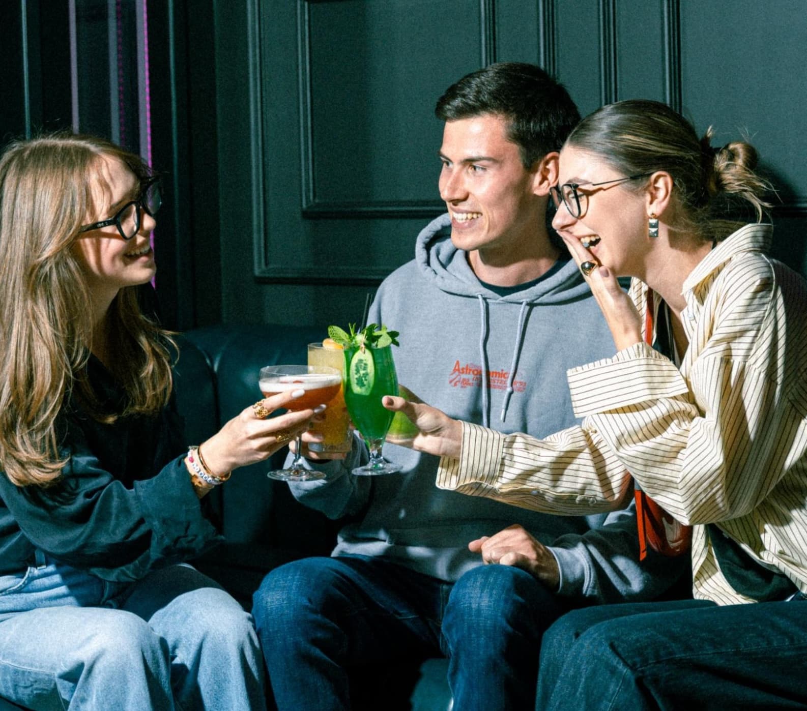 Happy hour Dubai with a group of friends enjoying their cocktail drinks from the bar.
