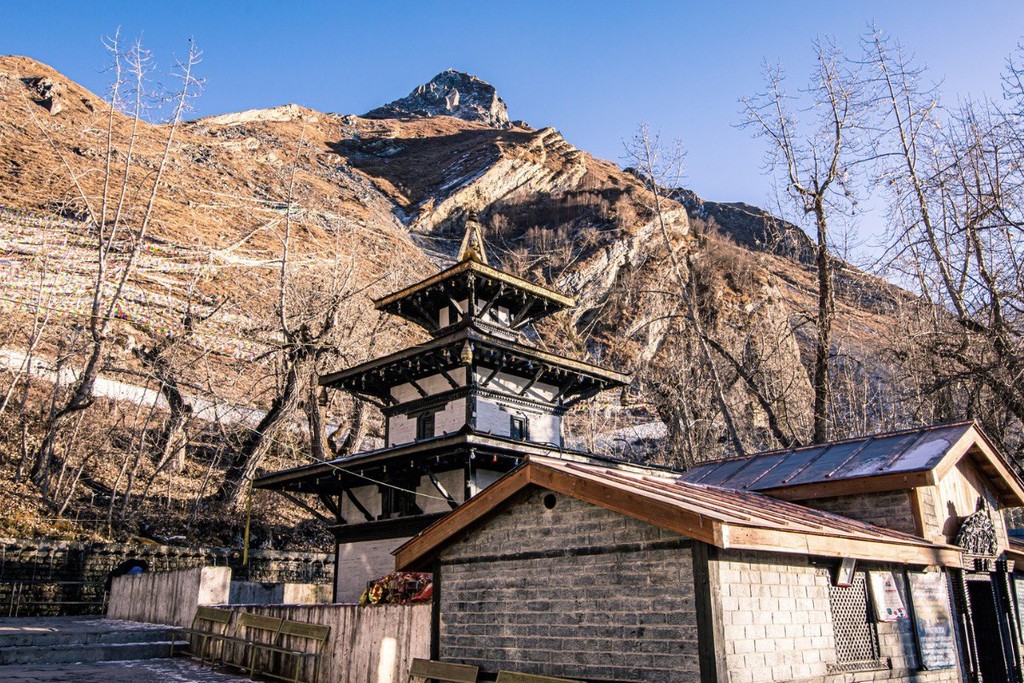 a view of a city and mountains from a distance